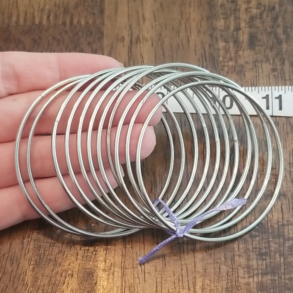 Lot of 11 silver tone bangles